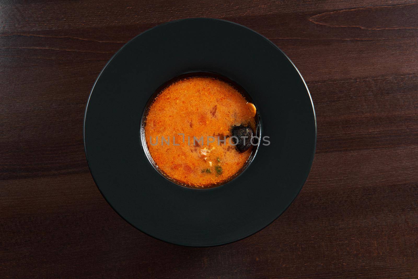 Tomato love. Top view of a bowl of delicious cold tomato gazpacho soup served at the restaurant