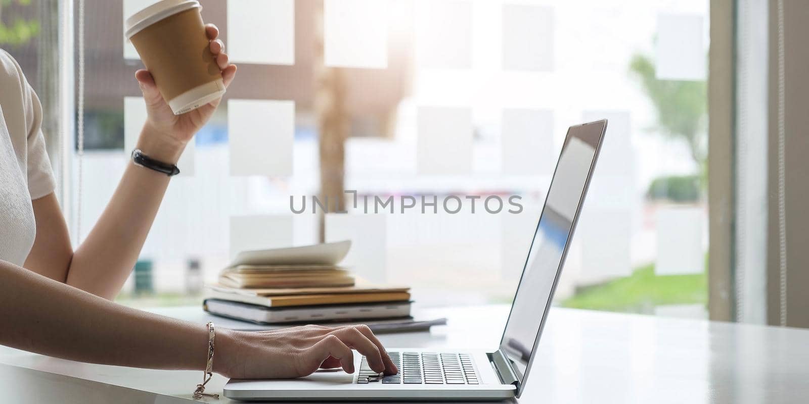 Close up hands of female employee using laptop at workplace, looking at screen, businesswoman preparing economic report, working online project, cheerful intern doing computer work, typing..