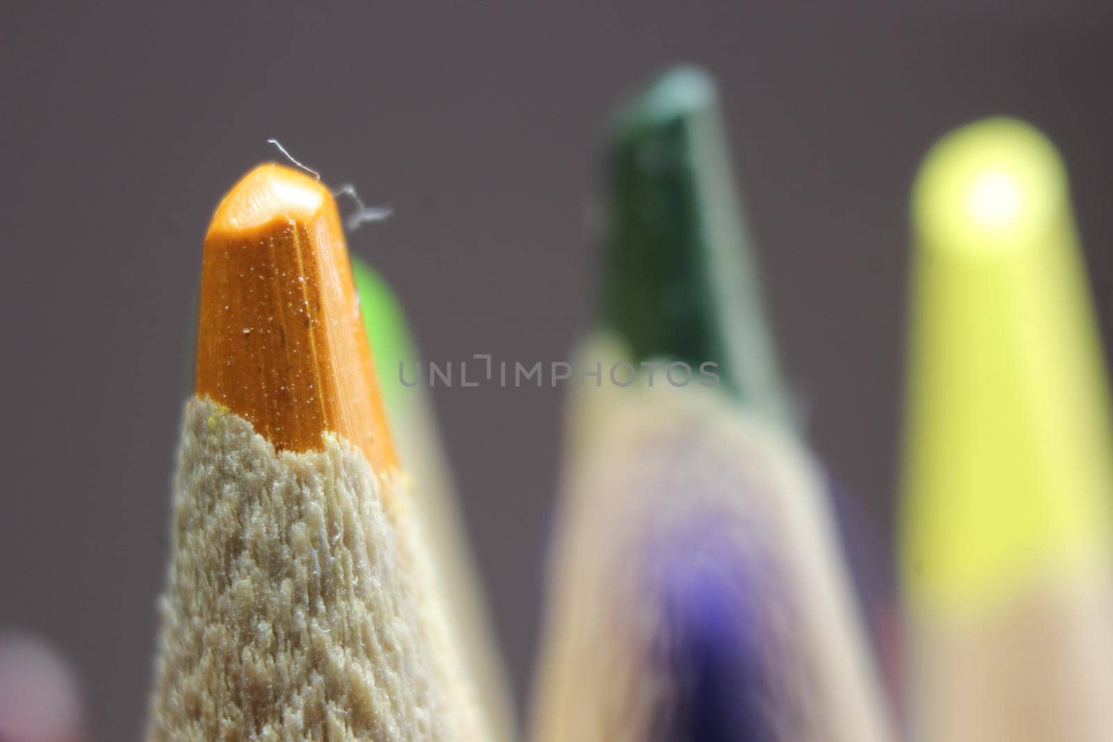 Macro view of the tip of the pencil on a black background. by Photochowk