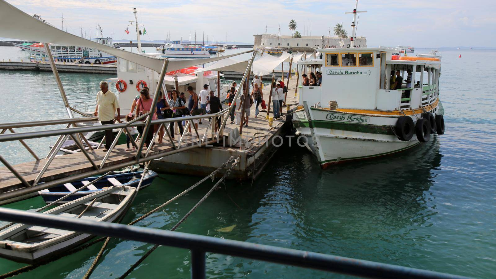 salvador, bahia, brazil - december 11, 2017: Passengers disembark from the Cavalo Marinho lll motorboat at the Maritime Terminal in Salvador, after crossing the Todos os Santos Bay in the Mar Grande region.