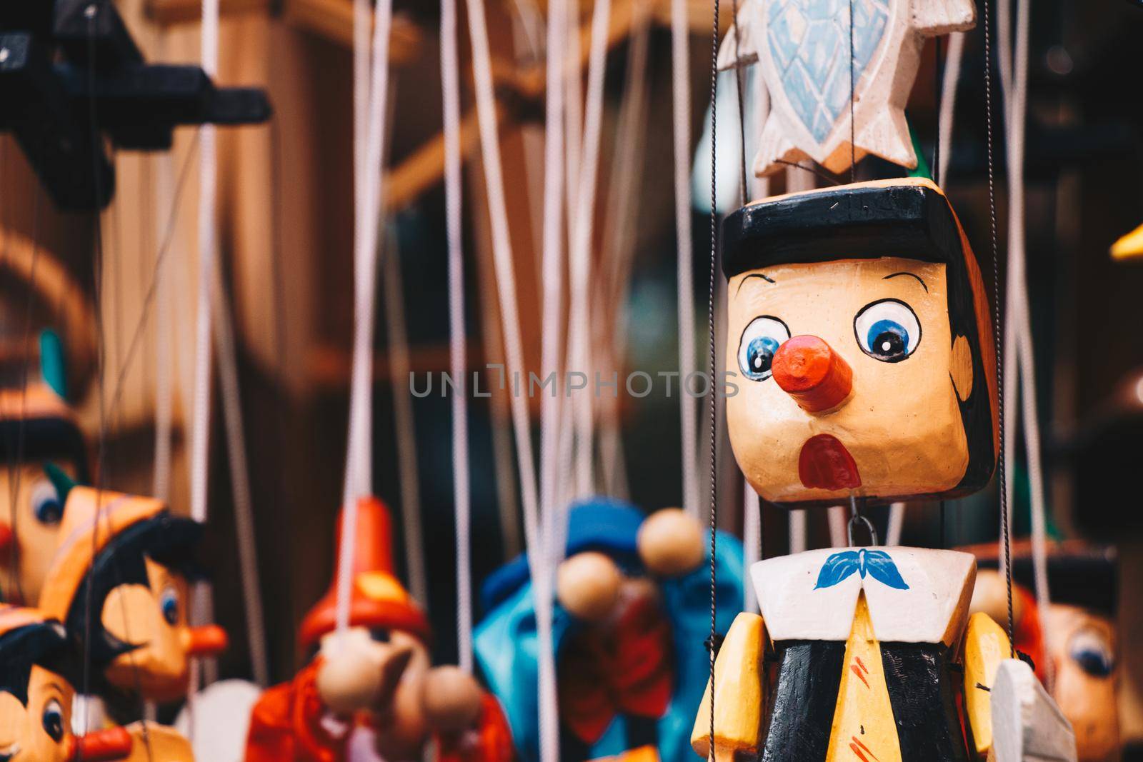 Wooden pinocchio doll with his long nose by berkay