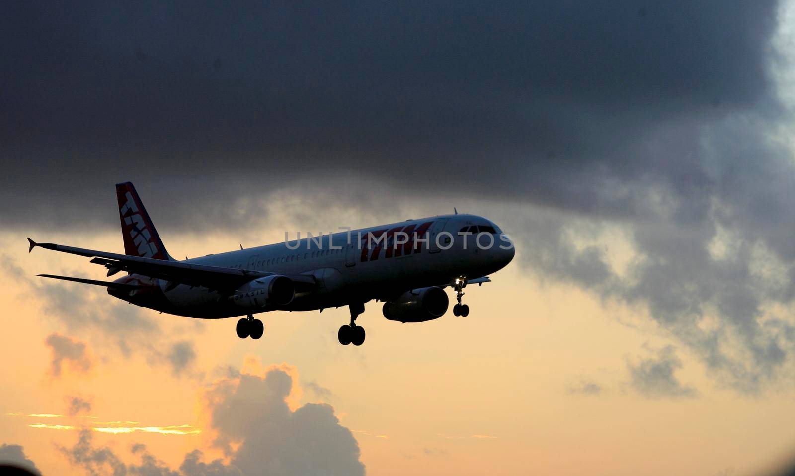 salvador, bahia, brazil - february 11, 2017: Airbus aircraft of Tam Linhas Aareas is seen during approach for landing at Salvador City Airport.