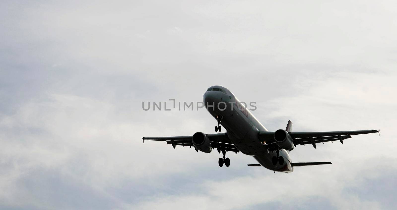 salvador, bahia, brazil - february 11, 2017: Airbus aircraft of Tam Linhas Aareas is seen during approach for landing at Salvador City Airport.