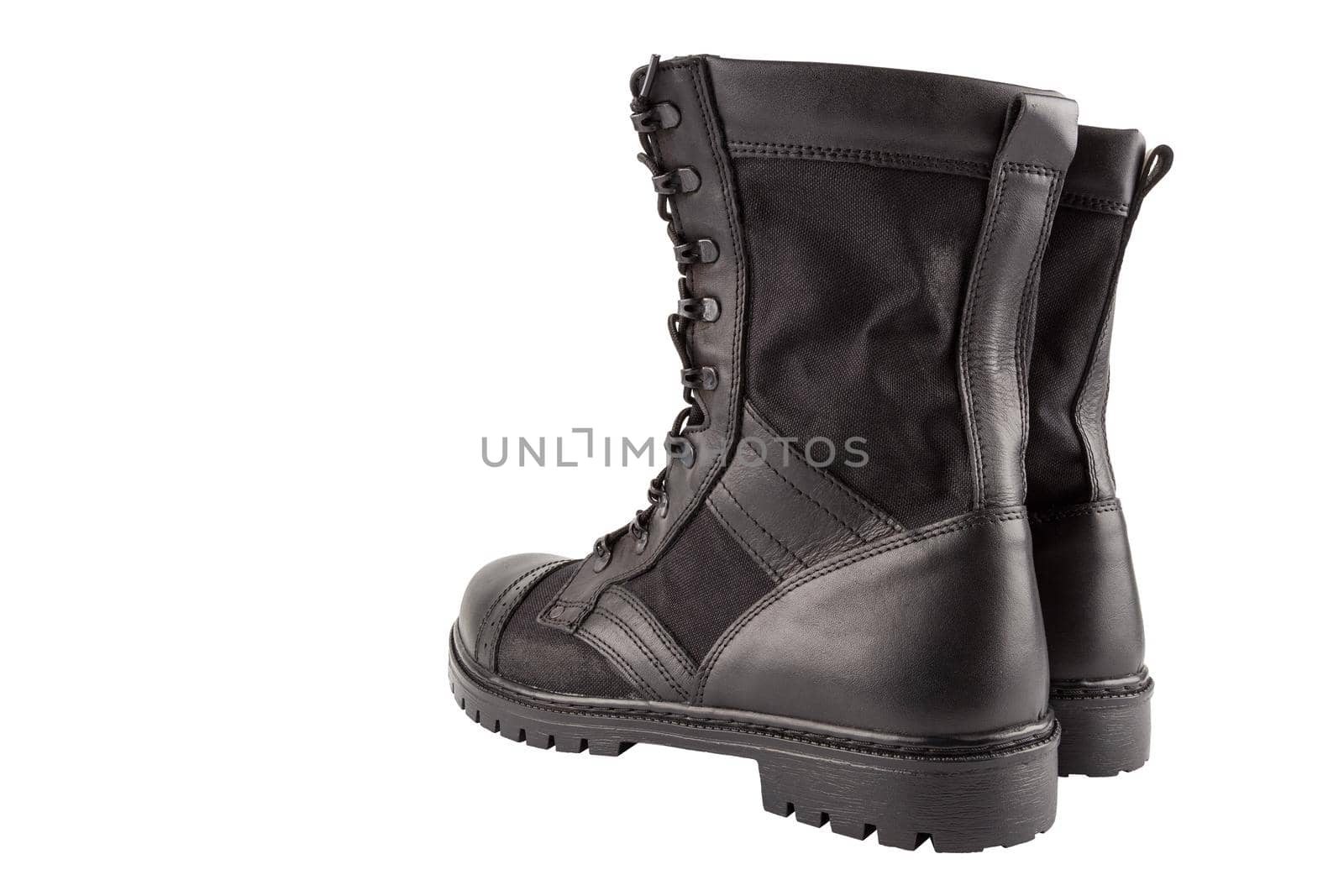 a pair of one new black lightweight military boots isolated on white background, standing vertically, view from back.