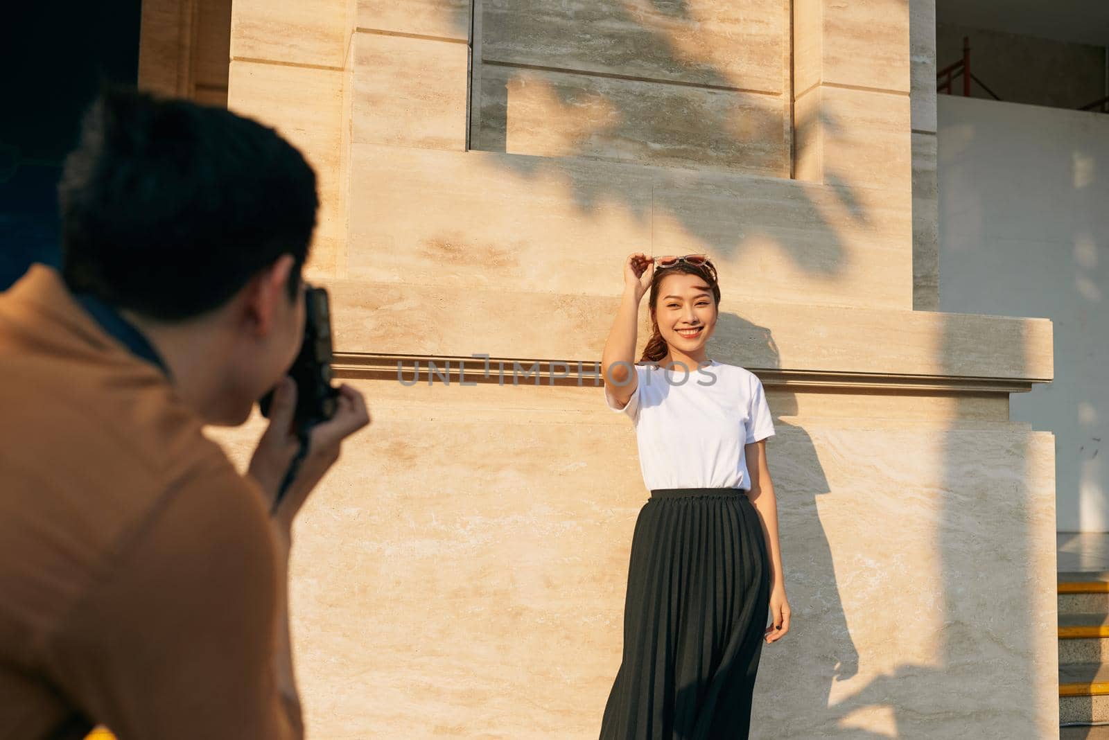 summer holidays and dating concept - couple taking photo picture in the city  by makidotvn