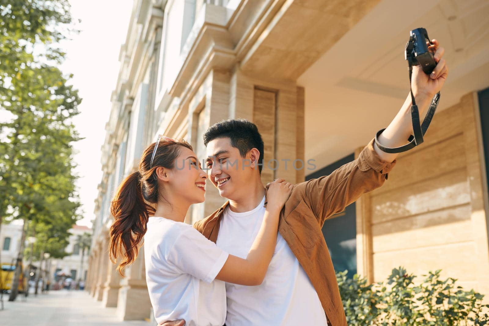 Happy tourists taking photo of themselves  by makidotvn