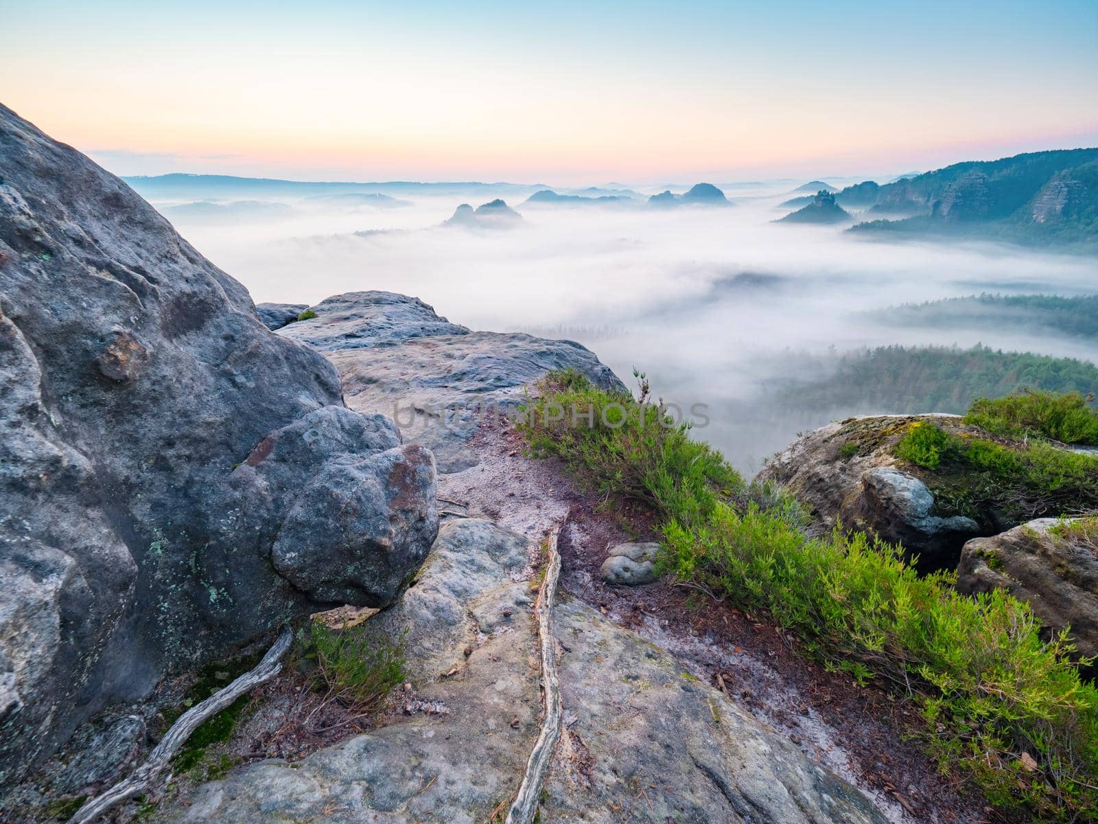 Misty wake up of misty landscape. Picturesque sunrise and a foggy morning in the Bad Schandau nature park region, Europe