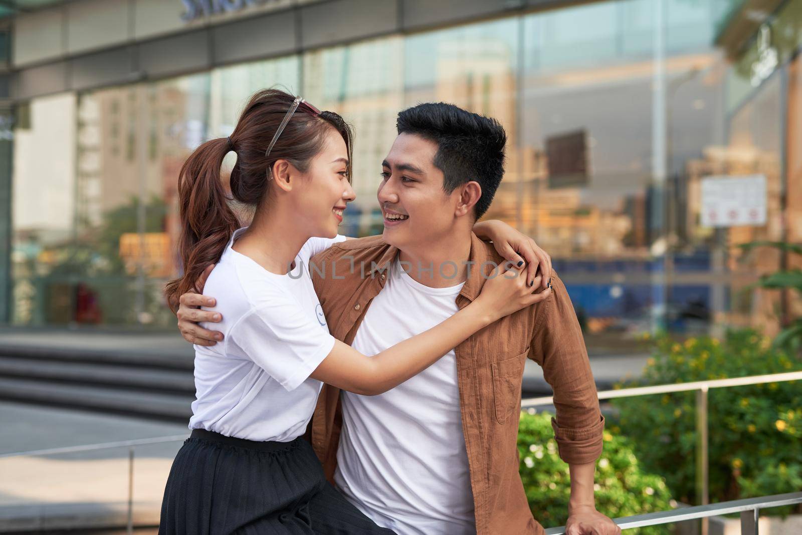 Young happy couple with shopping bags in the city,having fun together