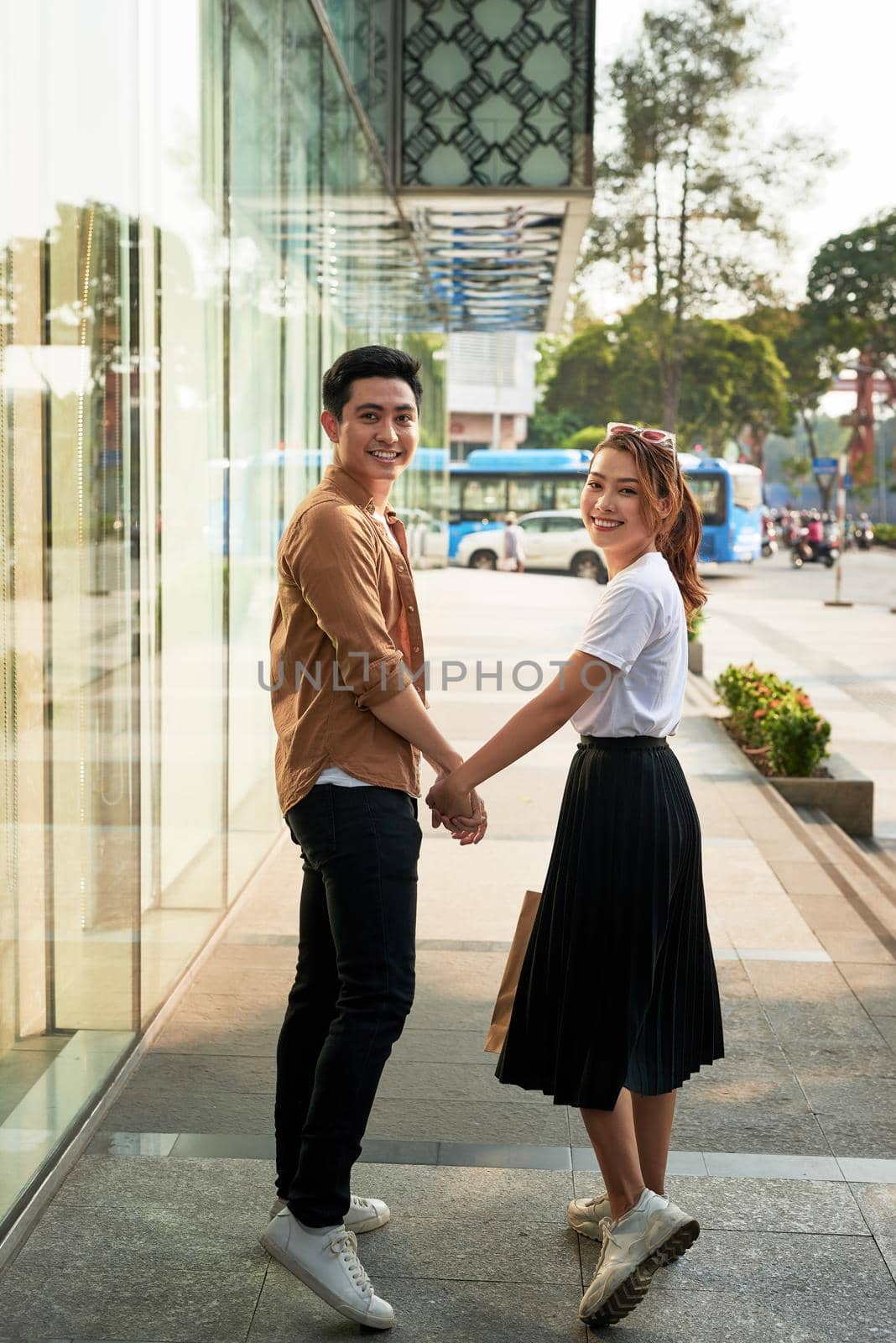 Young happy couple with shopping bags in the city,having fun together