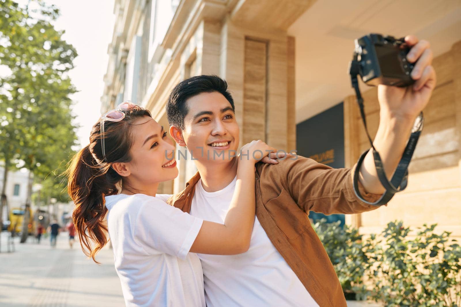 Happy tourists taking photo of themselves  by makidotvn