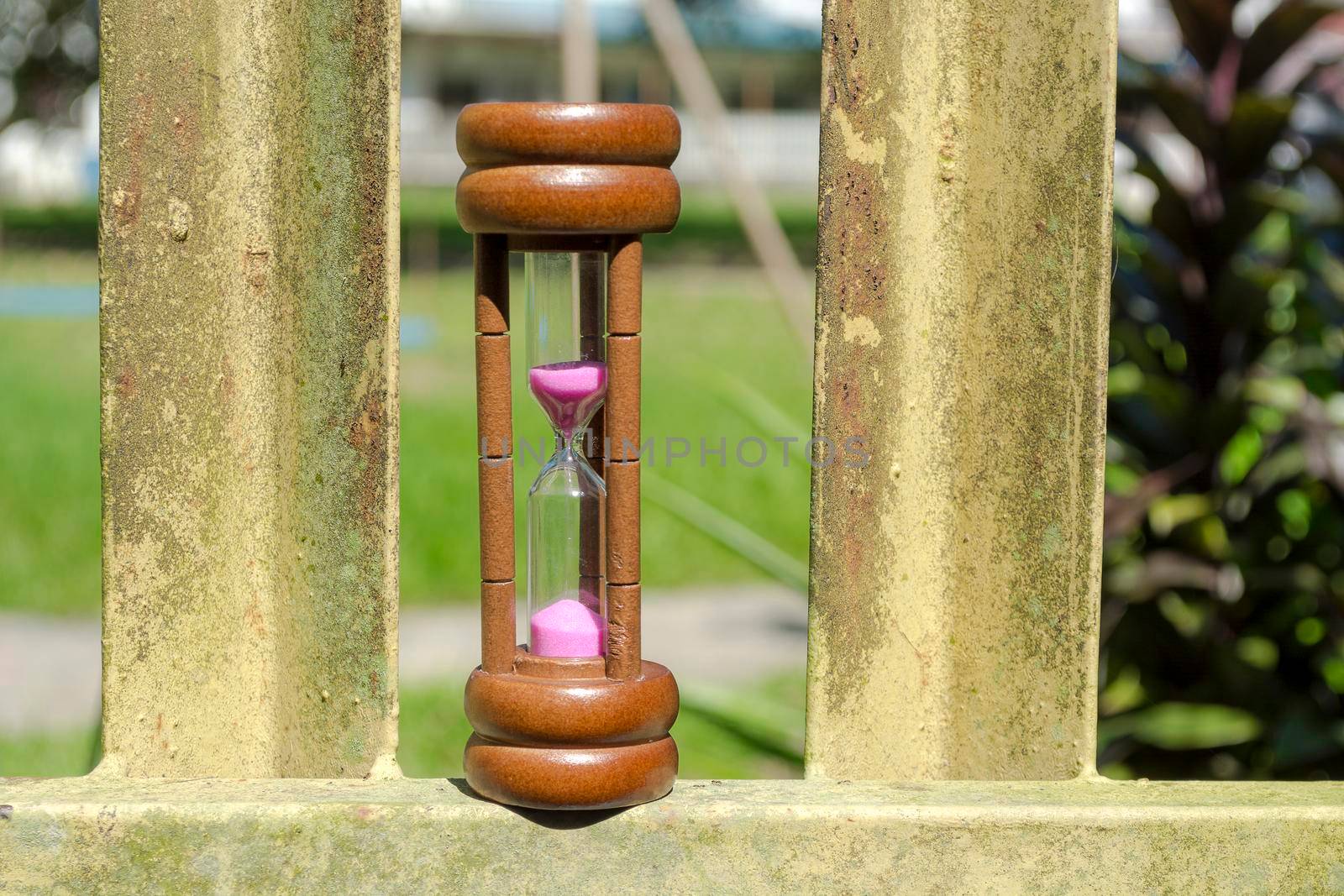 Hourglass as time passing concept for business deadline and running out of time