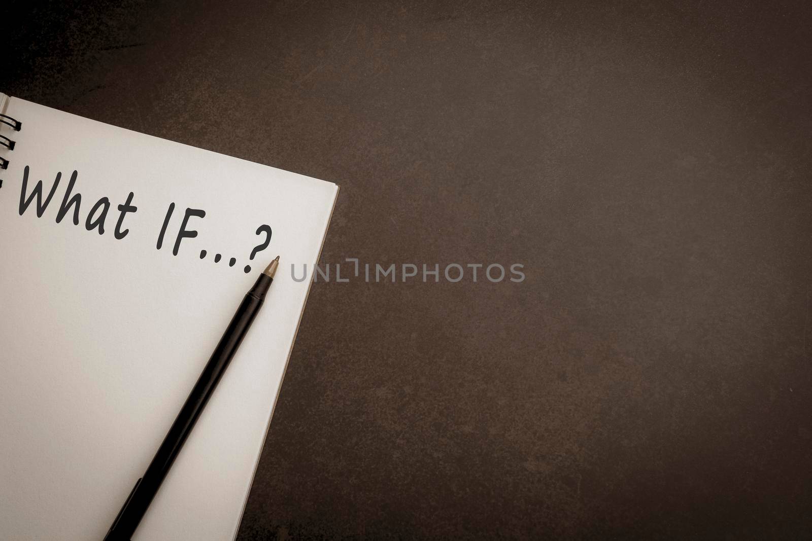 What If text on notepad with dark background