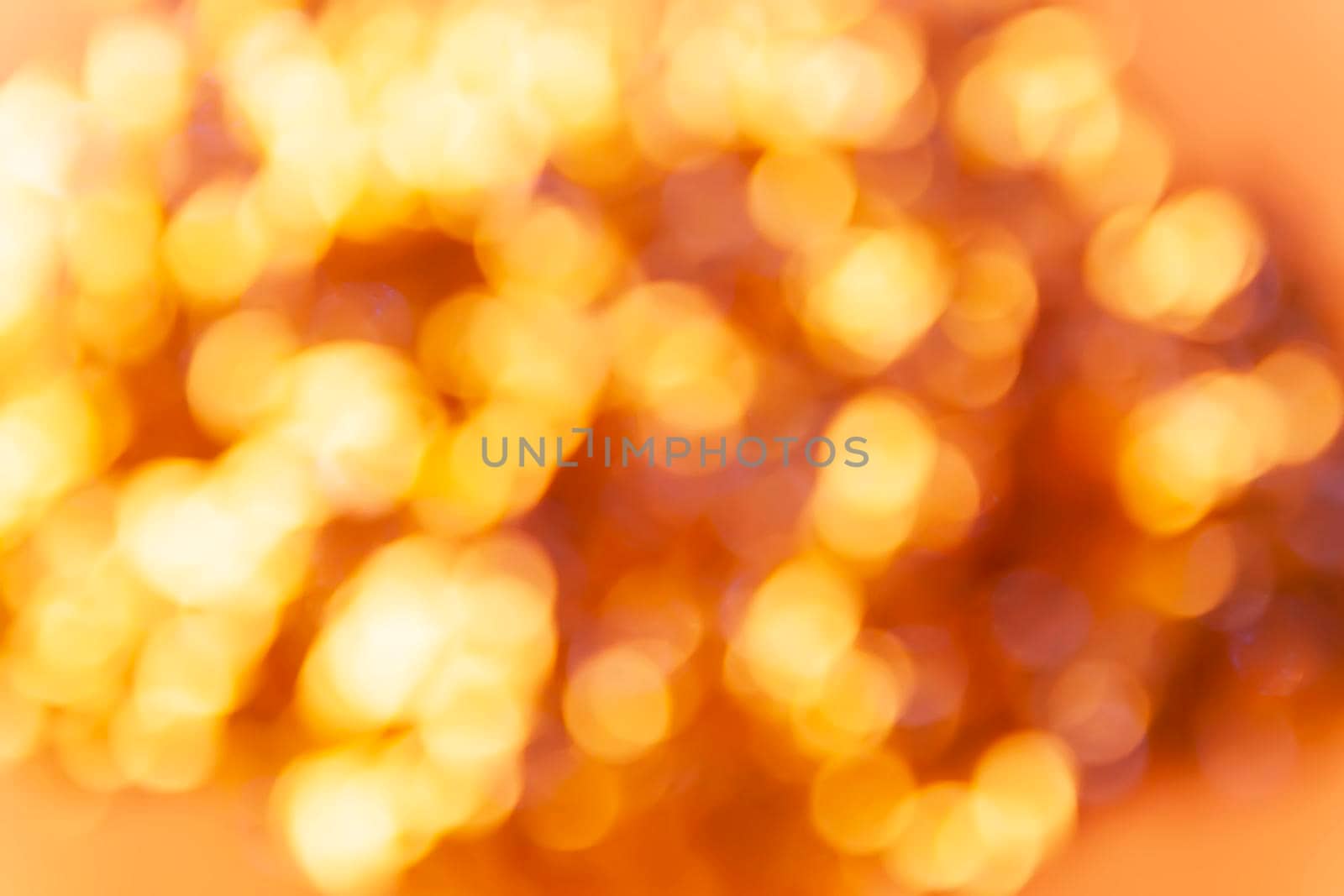 Abstract festive bright colorful background of blurred unfocused lights