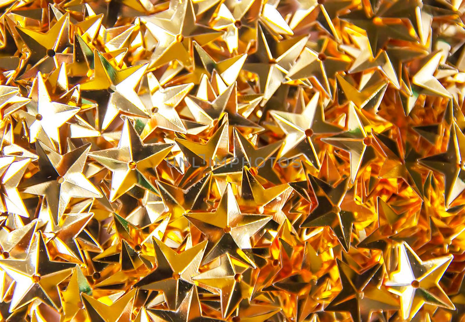 Golden confetti stars festive bright background or Christmas or New Year party decoration