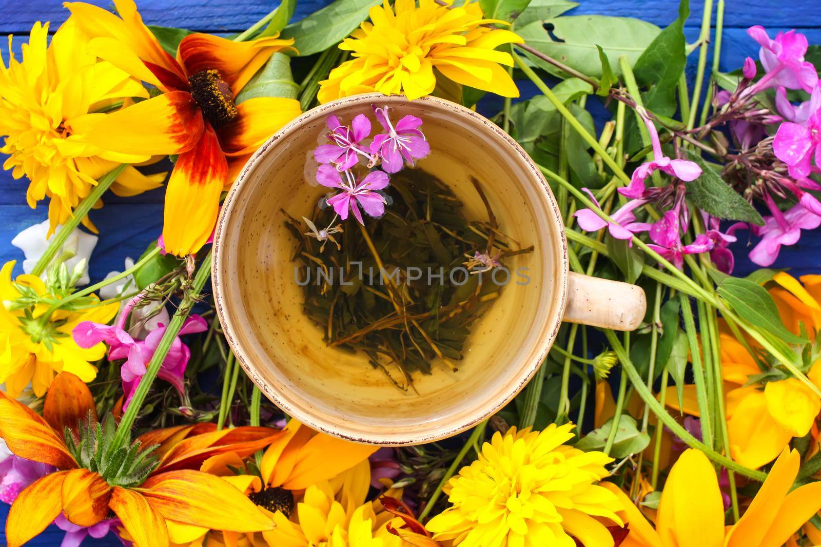 Natural herbal tea with medical herbs in ceramic cup