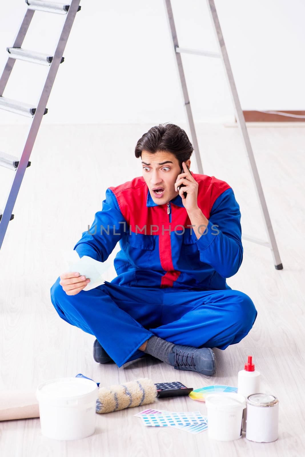 Young painter trying to match colours for painting job