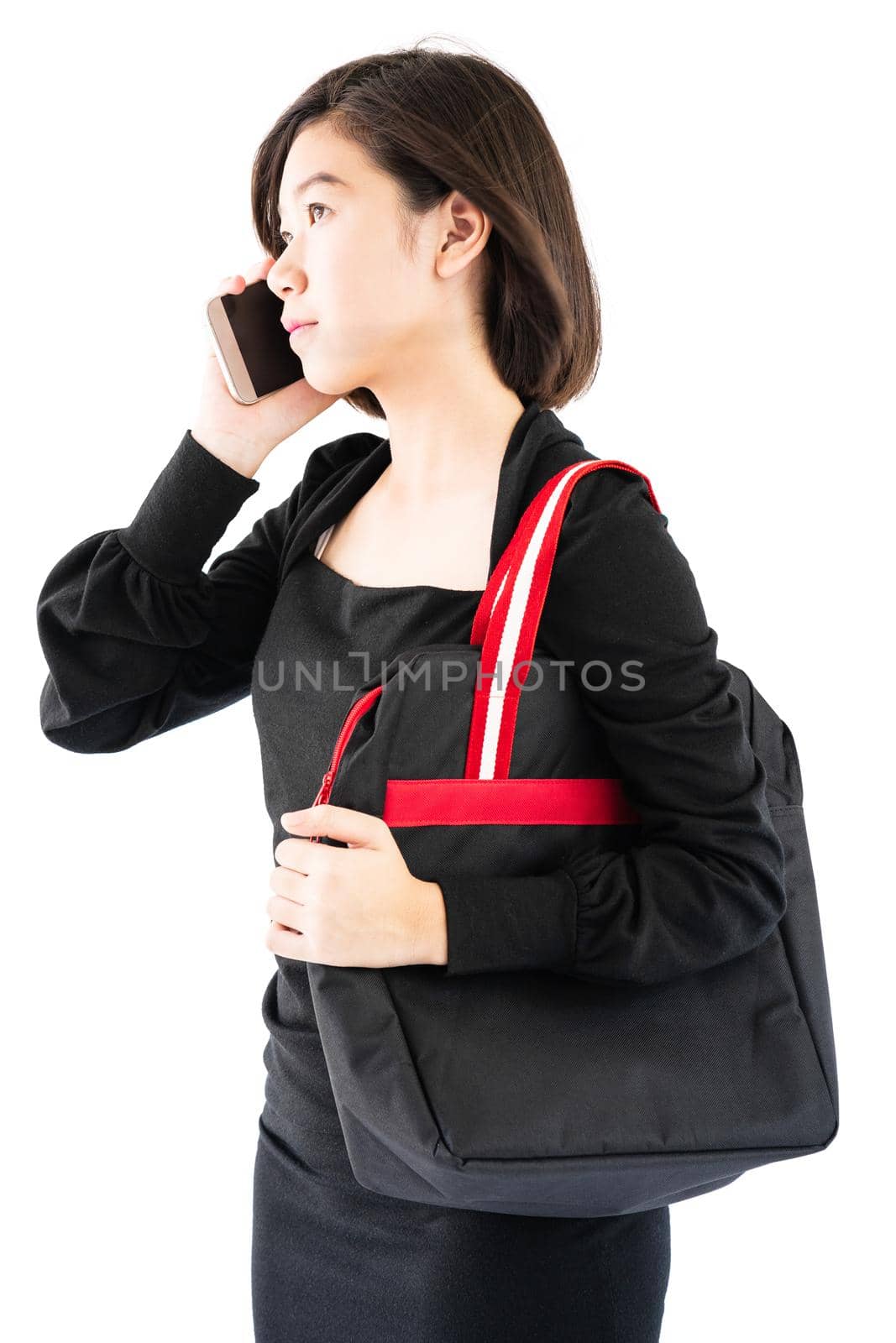Woman carrying a black shopping bag using cellphone shopping online isolate on white background