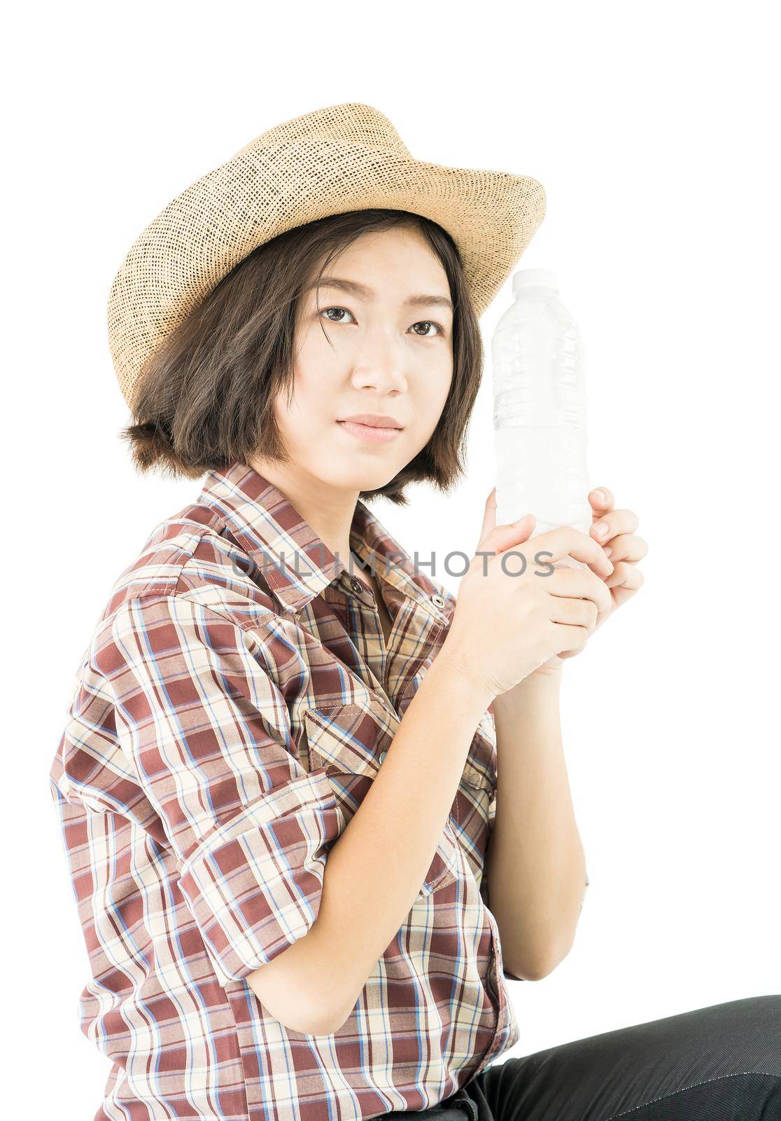 Woman in a plaid shirt holding a water bottle on white background by stoonn
