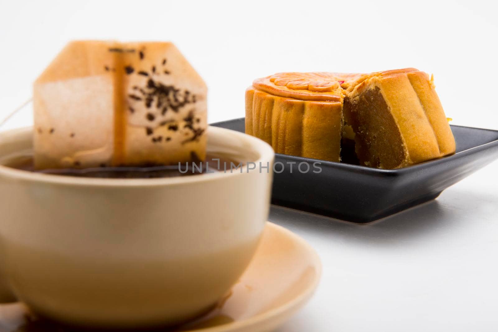 Mooncake and tea,Chinese mid autumn festival food. by titipong