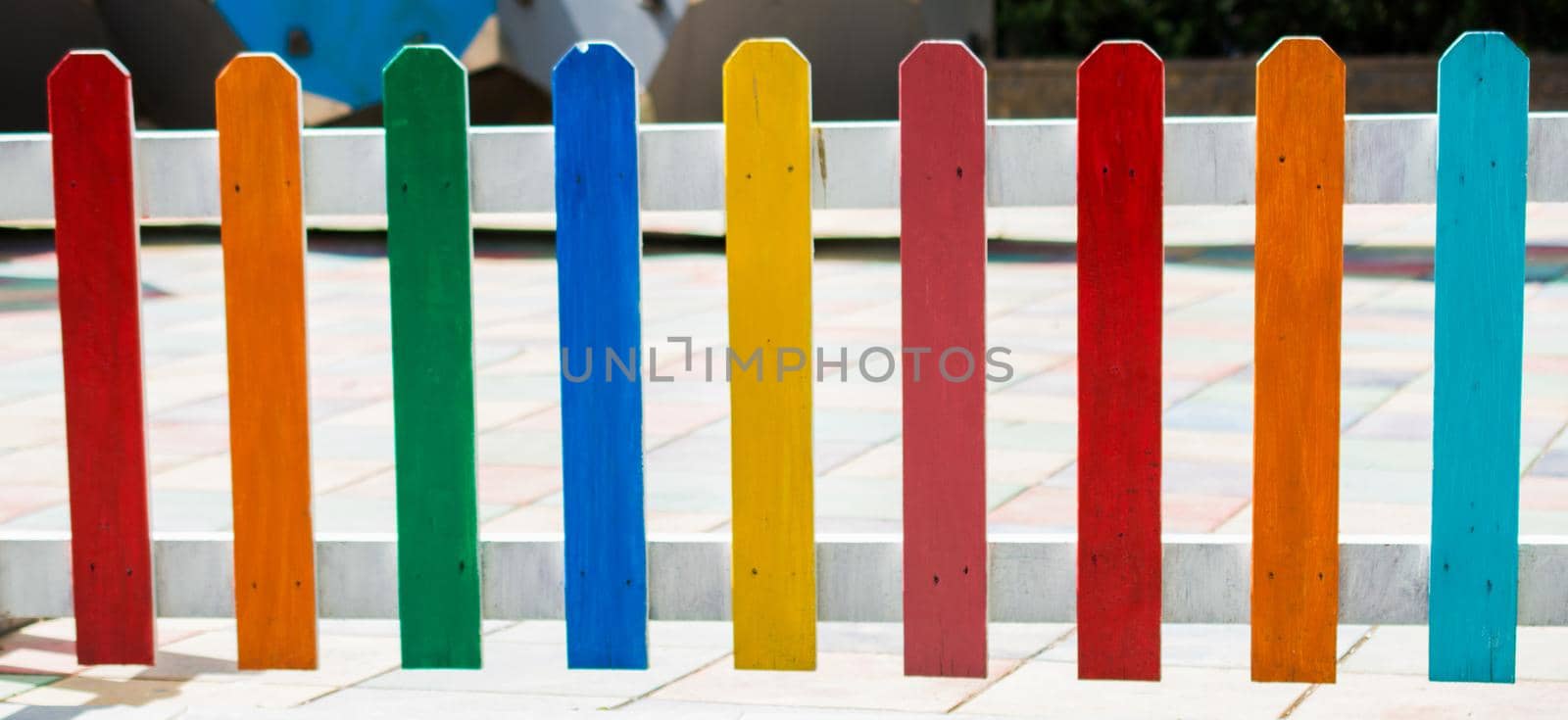 Close up of a part of decorative colorful wooden fence by berkay