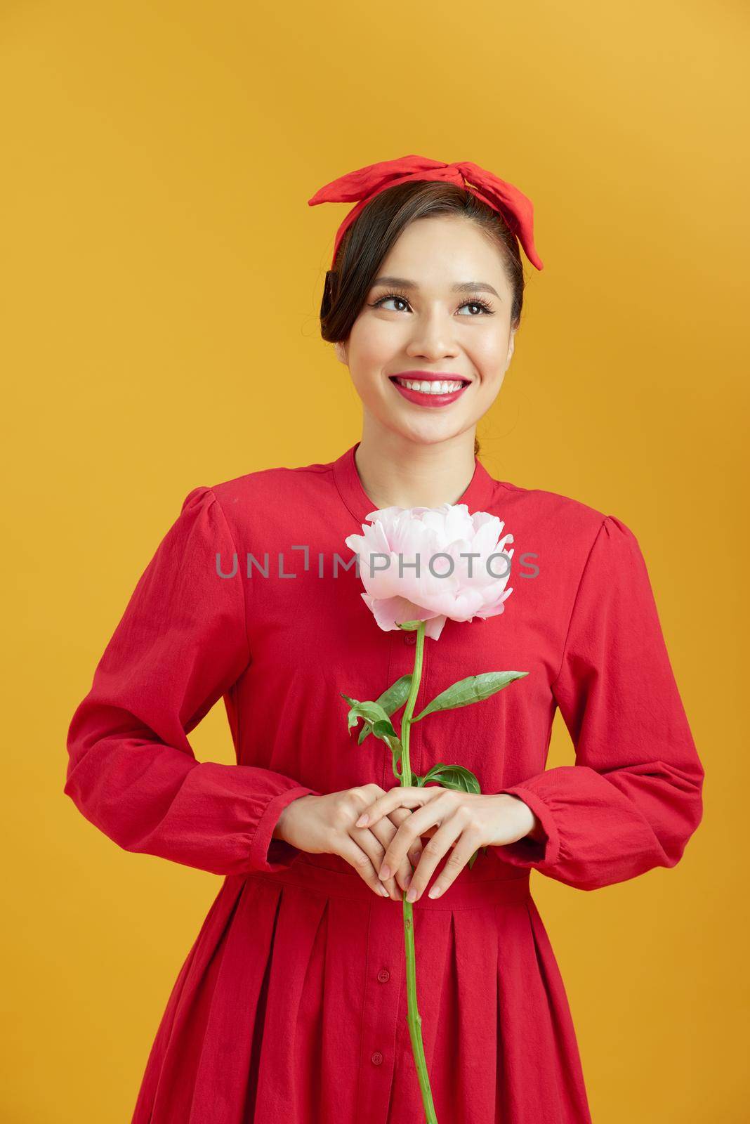 woman holding peony bouquet by makidotvn