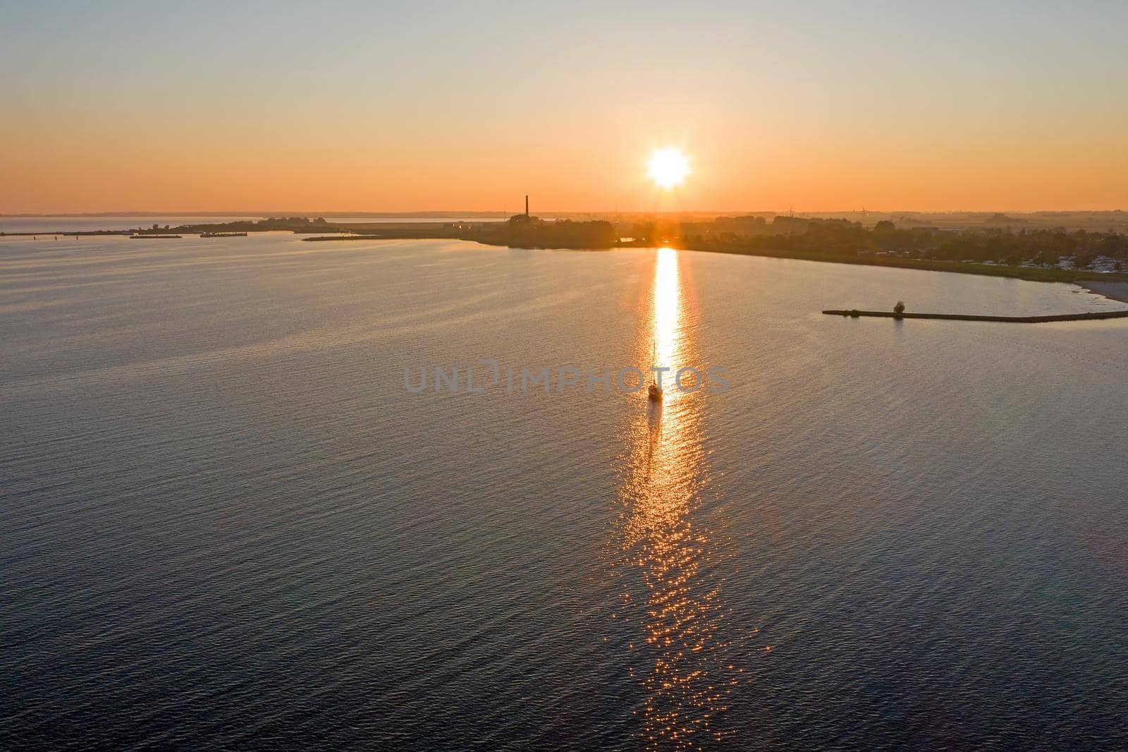 Aerial from a beautiful sunset at the IJsselmeer near Lemmer in the Netherlands