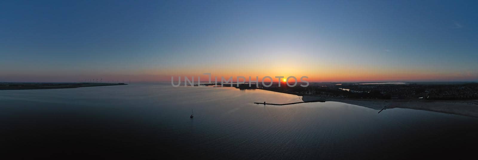 Aerial from the IJsselmeer near Lemmer in the Netherlands at sunset