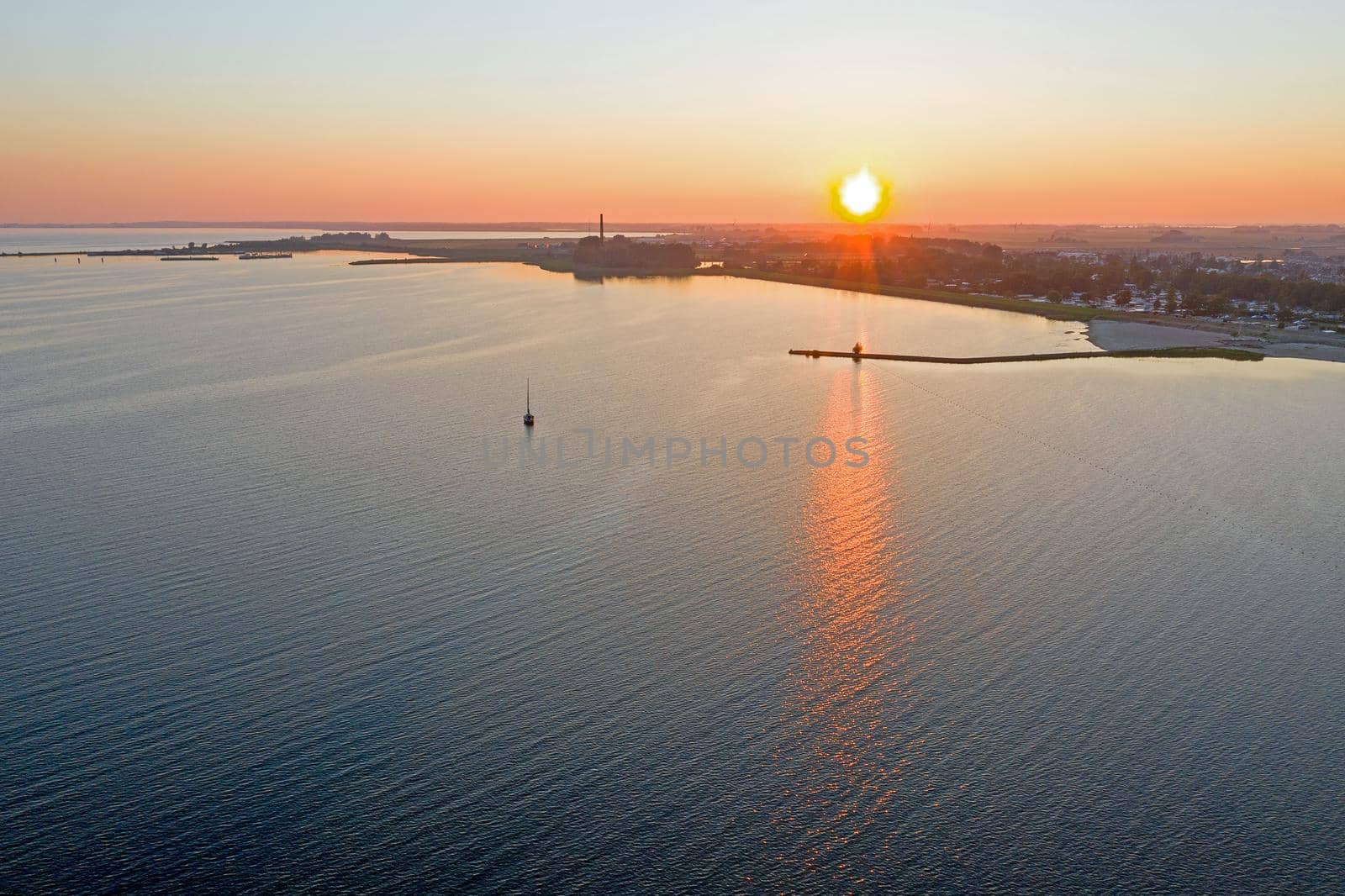 Aerial from a beautiful sunset at the IJsselmeer near Lemmer in the Netherlands by devy