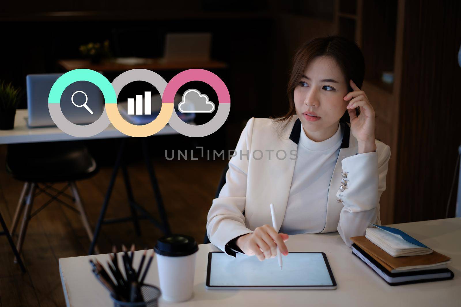 Young woman Accountant do audit tax of company by digital tablet in application on cloud with virtual icon on screen by itchaznong