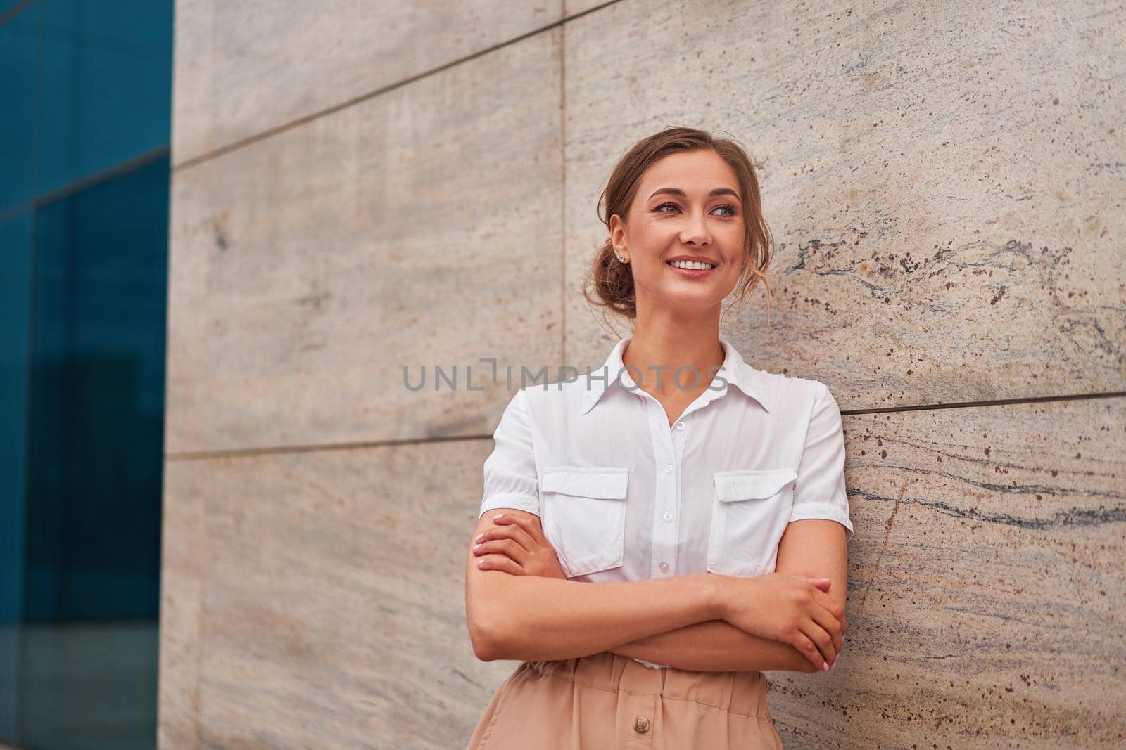 Businesswoman successful woman business person standing arms crossed outdoor corporate building exterior Smile happy caucasian confidence professional business woman middle age female entrepreneur