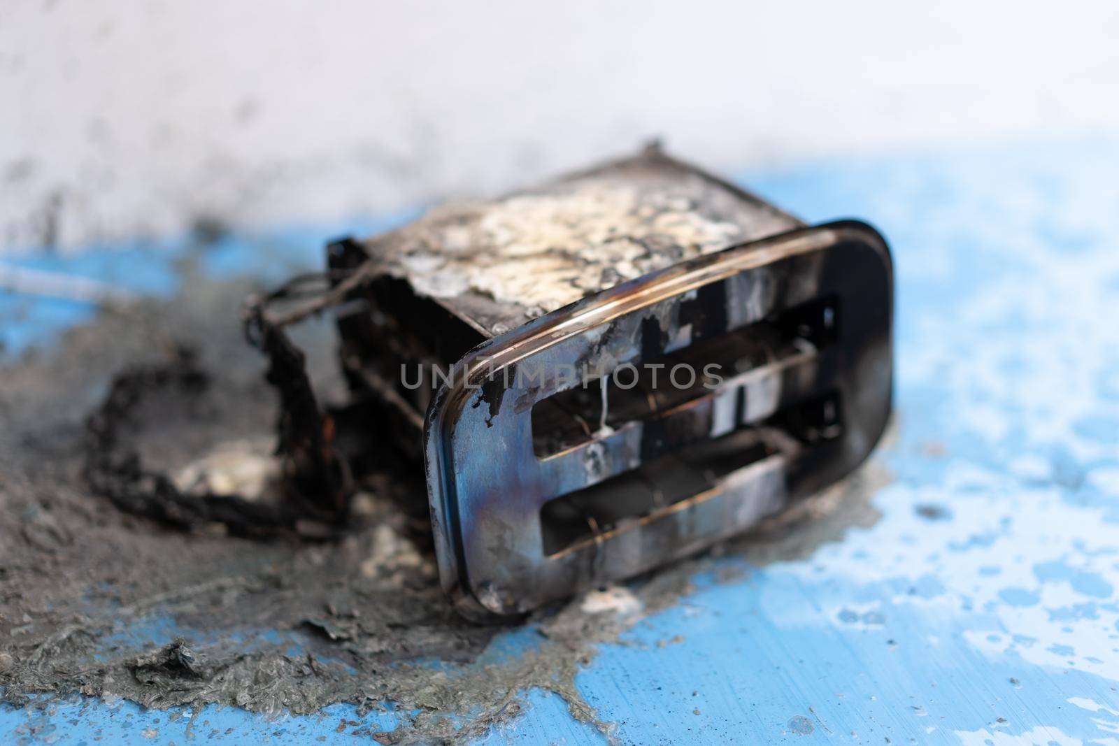 Toaster after fire. Household electrical appliance fire hazard by andreonegin