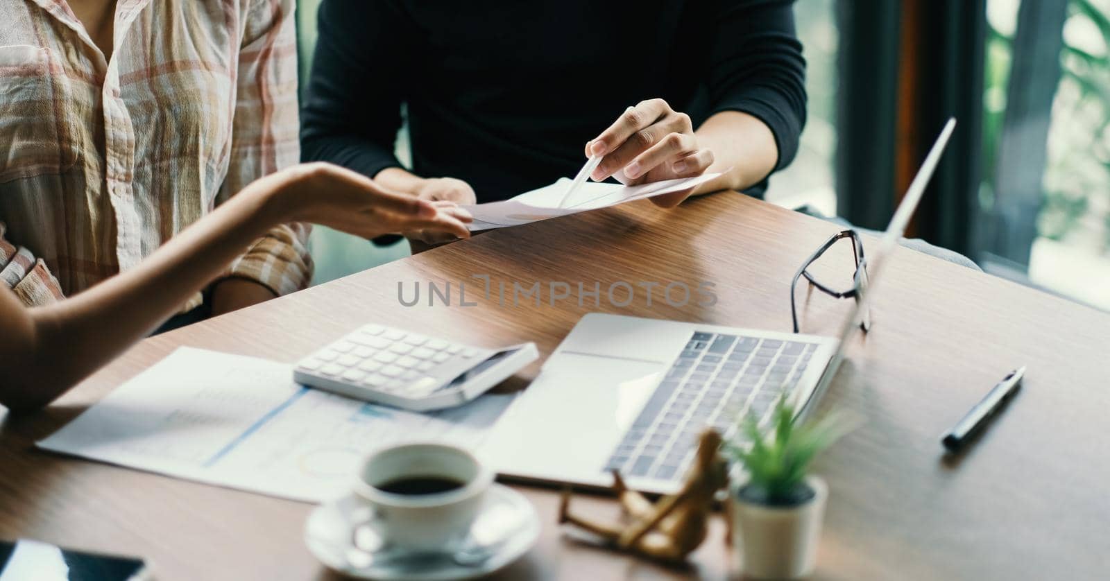 Close up business adviser meeting to analyze and discuss the situation on the financial report in the meeting room.Investment Consultant,Financial Consultant,Financial advisor and accounting concept