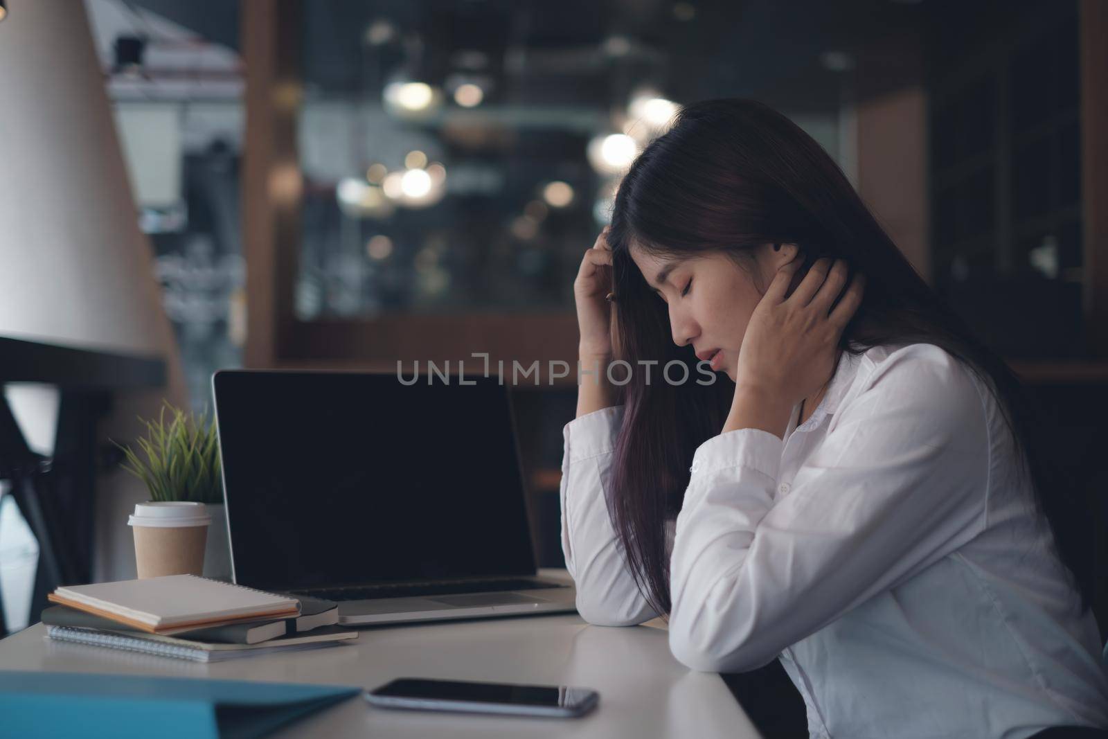 Frustrated stressed business owner or accountant sitting in an office