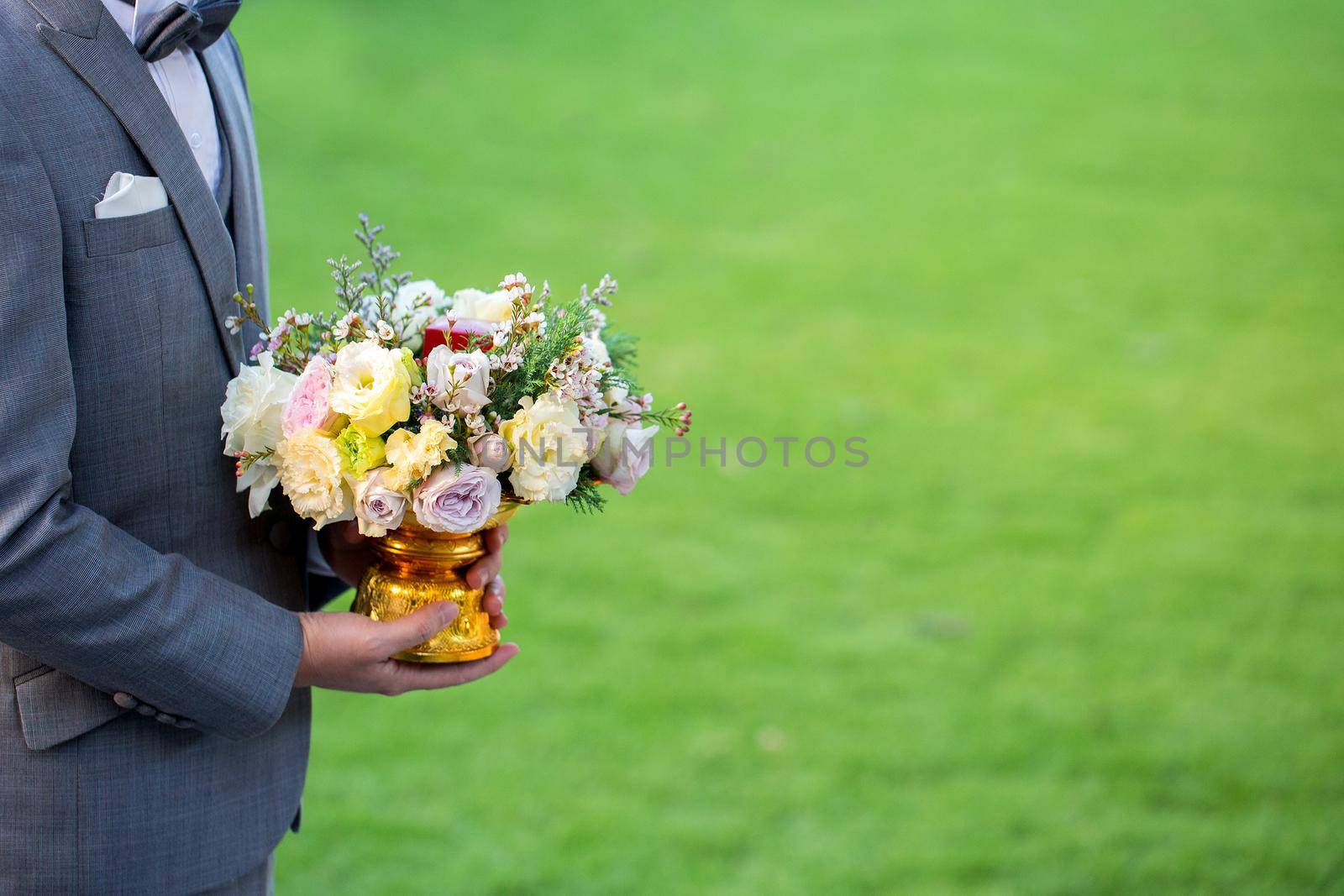 Flowers in hand groom