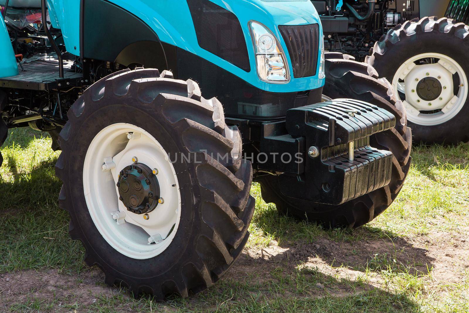 Modern tractor on modern agricultural machinery.