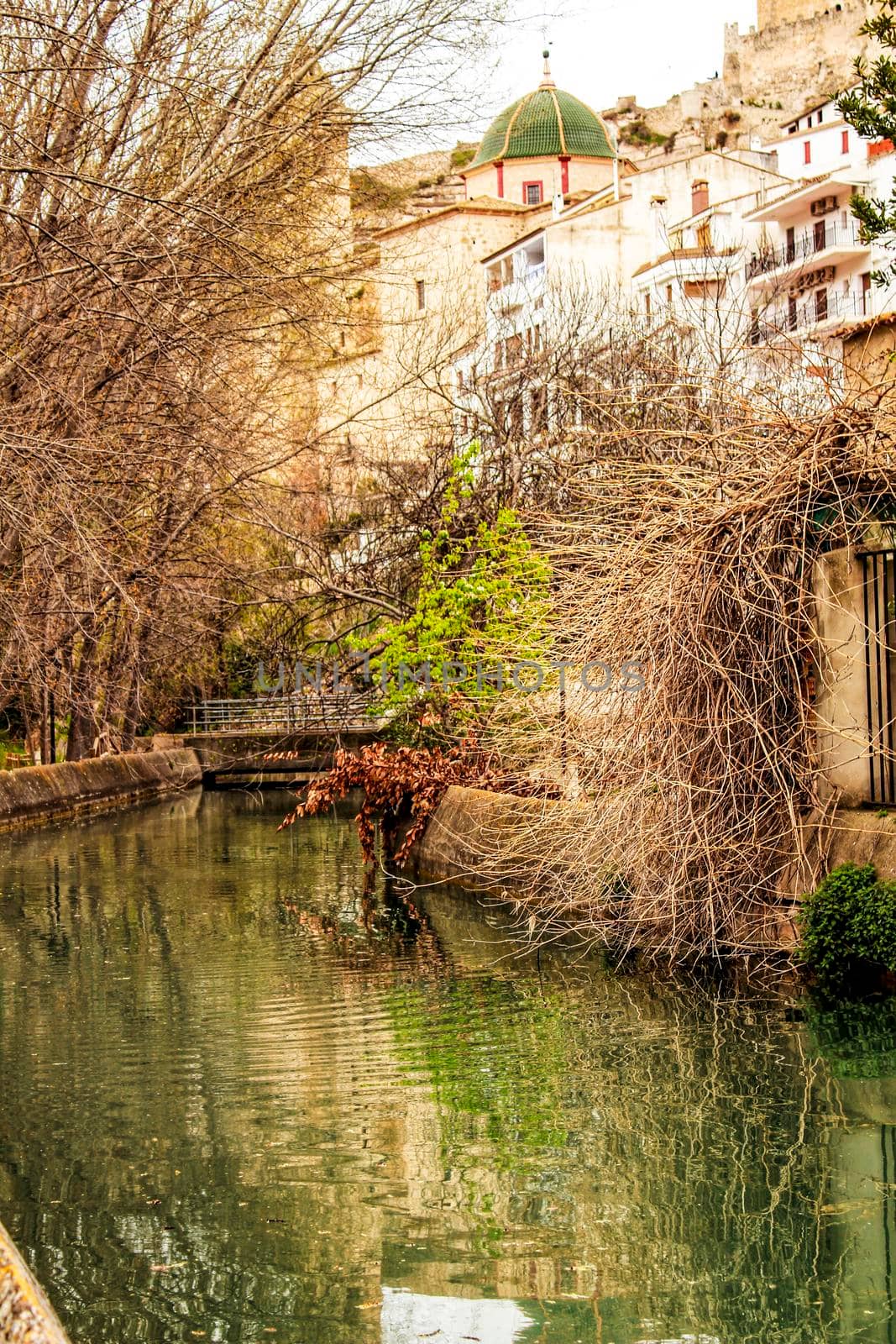 Water channel in Alcala del Jucar and vegetation