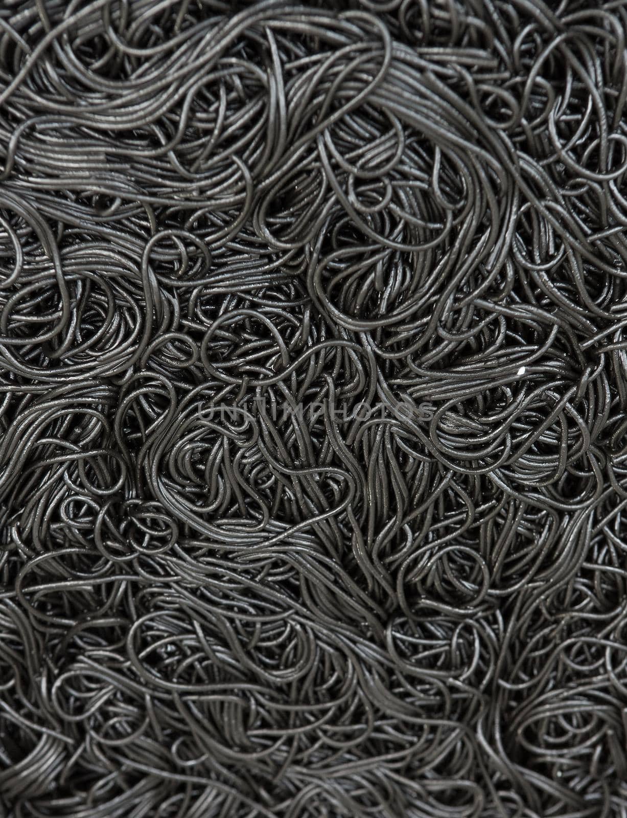 Black dried noodles soaked in a cuttlefish ink