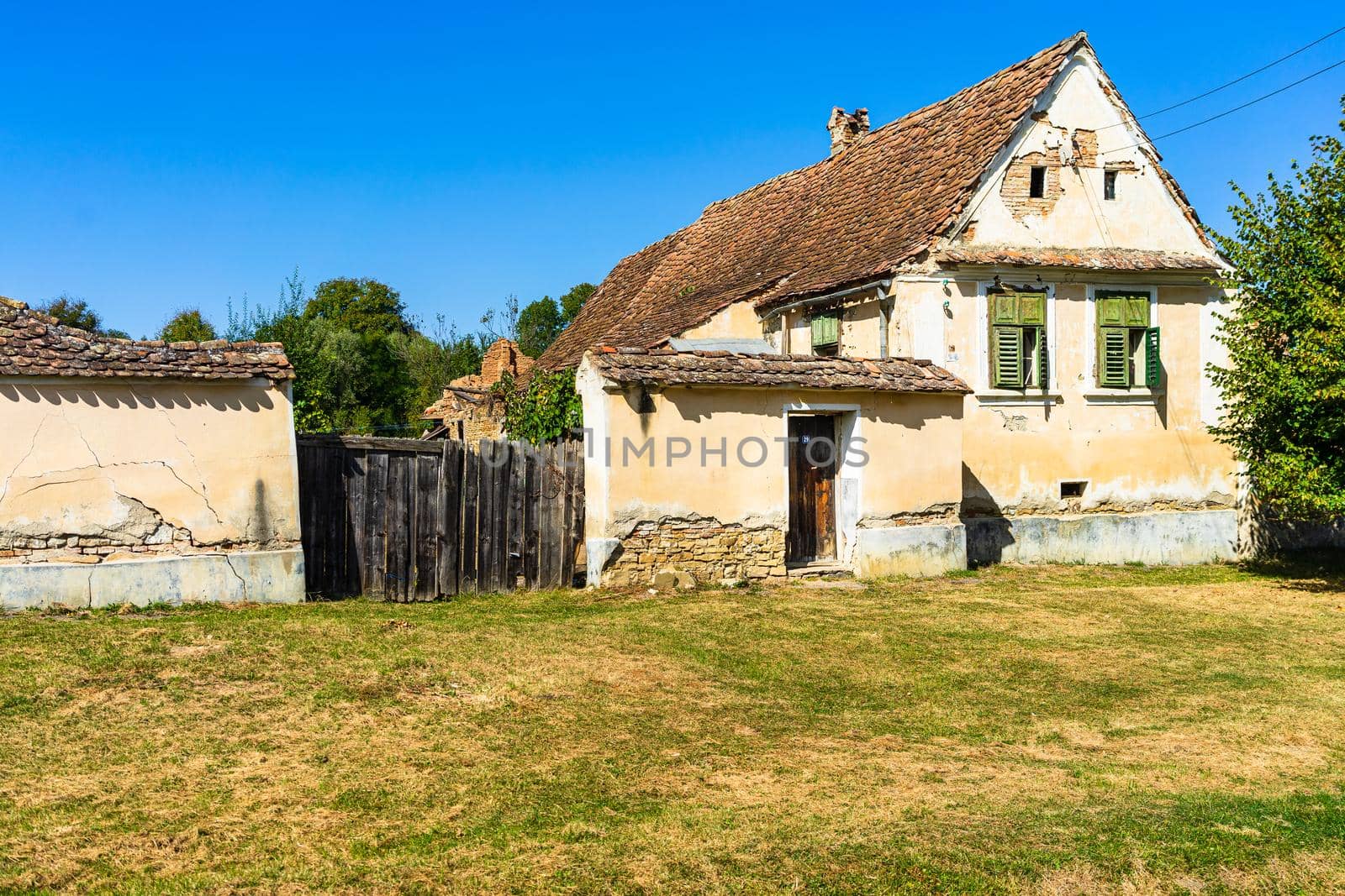 Typical rural landscape and rustic houses in Barcut -Bekokten, Transylvania, Romania, 2021. by vladispas