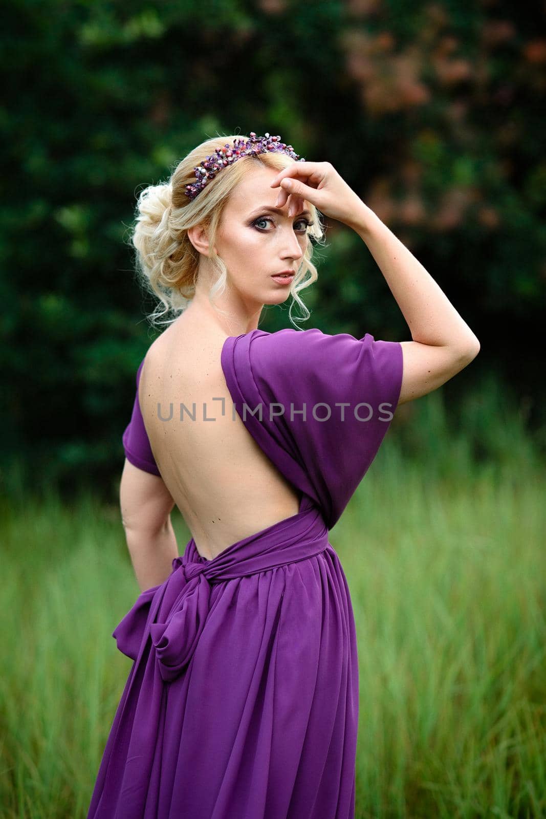 Girl model blonde in a lilac dress with a bouquet by Andreua