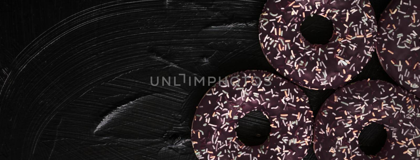 Bakery, branding and cafe concept - Frosted sprinkled donuts, sweet pastry dessert on rustic wooden background, doughnuts as tasty snack, top view food brand flat lay for blog, menu or cookbook design