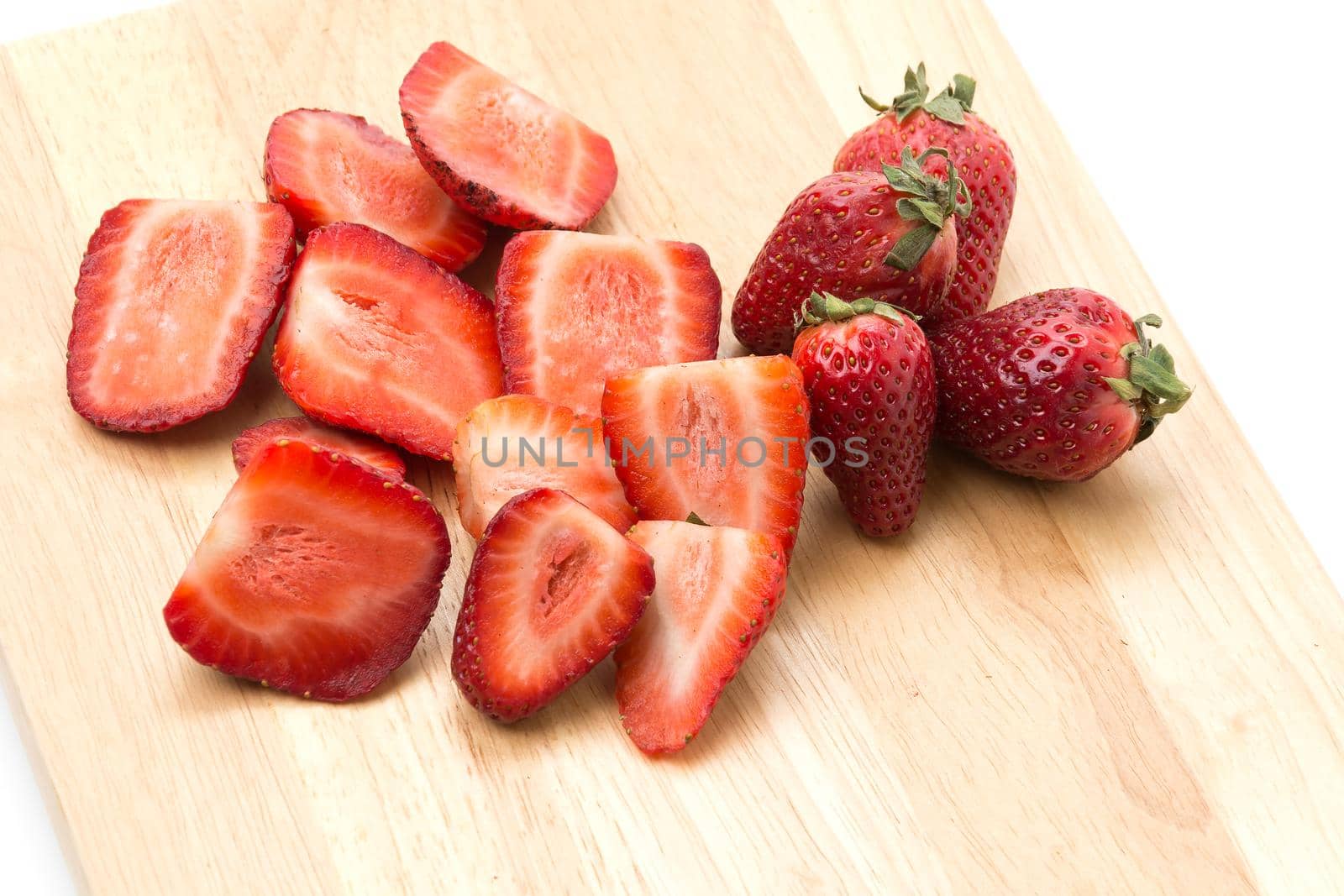 strawberry slice on wood board