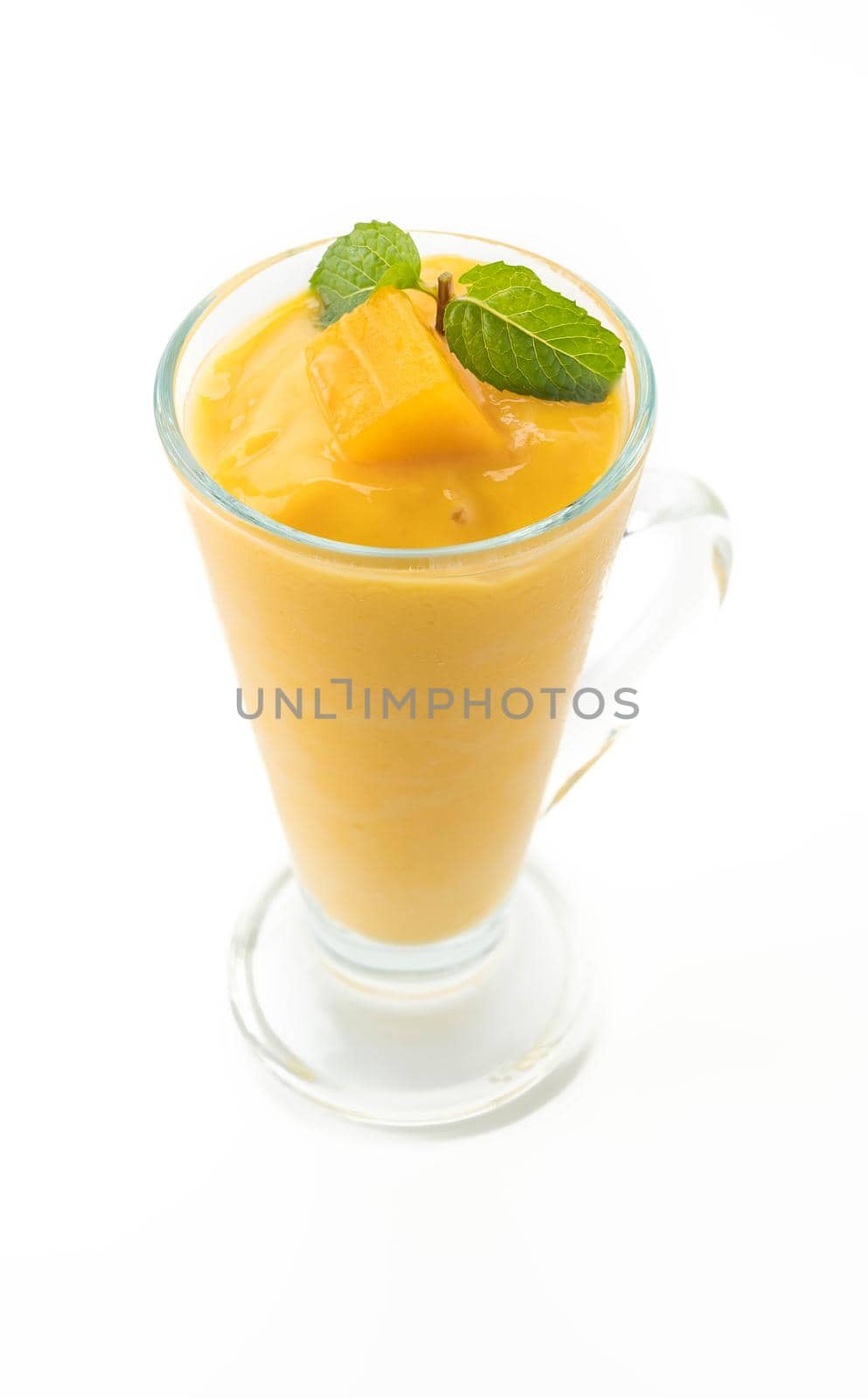 fresh mango smoothie on white background