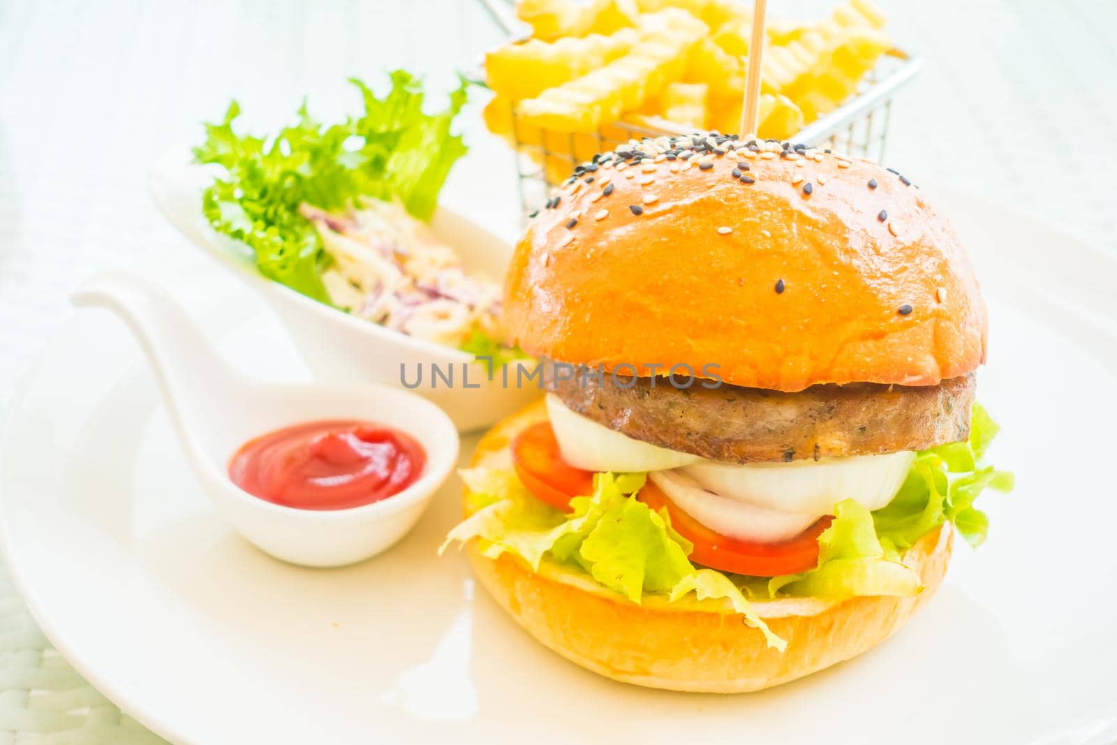 Selective focus point on beef hamburger with french fries - Junk food style