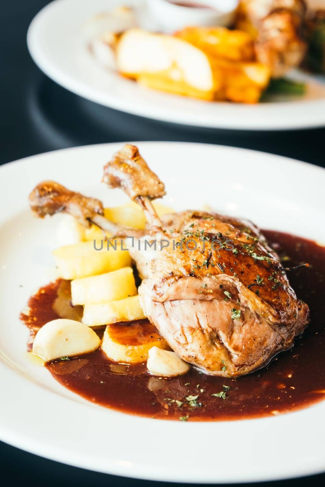 Duck breast steak with sauce in white plate