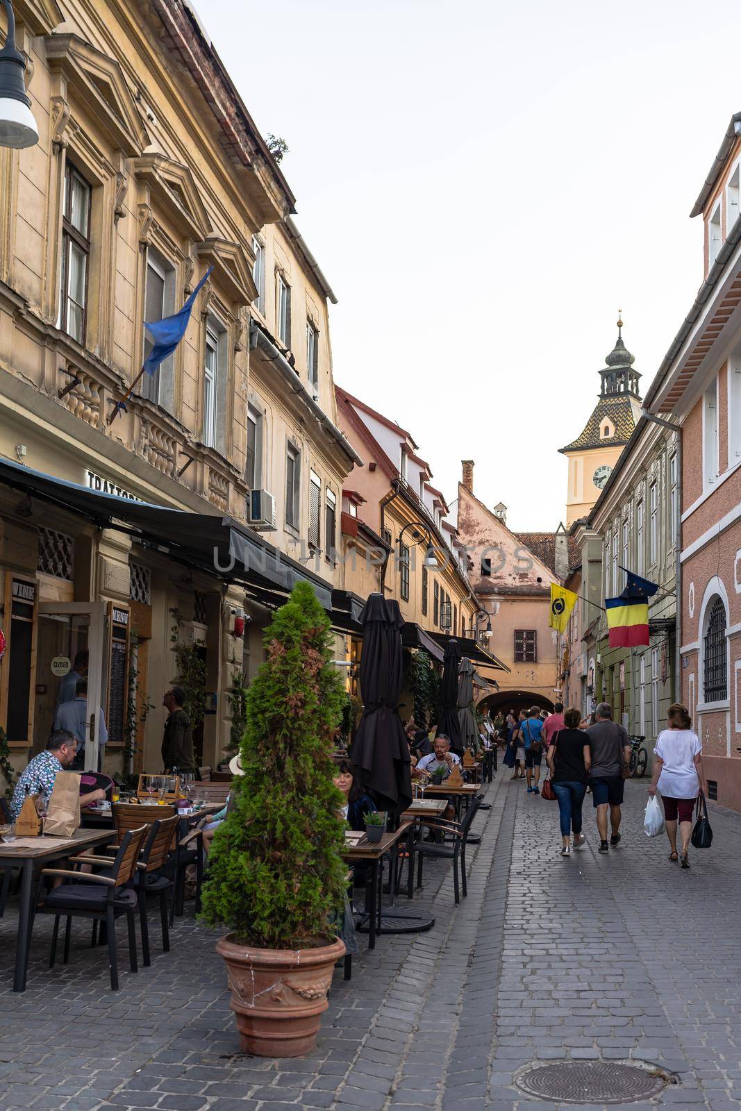 People walking, relaxing and have fun on the main streets in downtown of Brasov, Romania, 2020