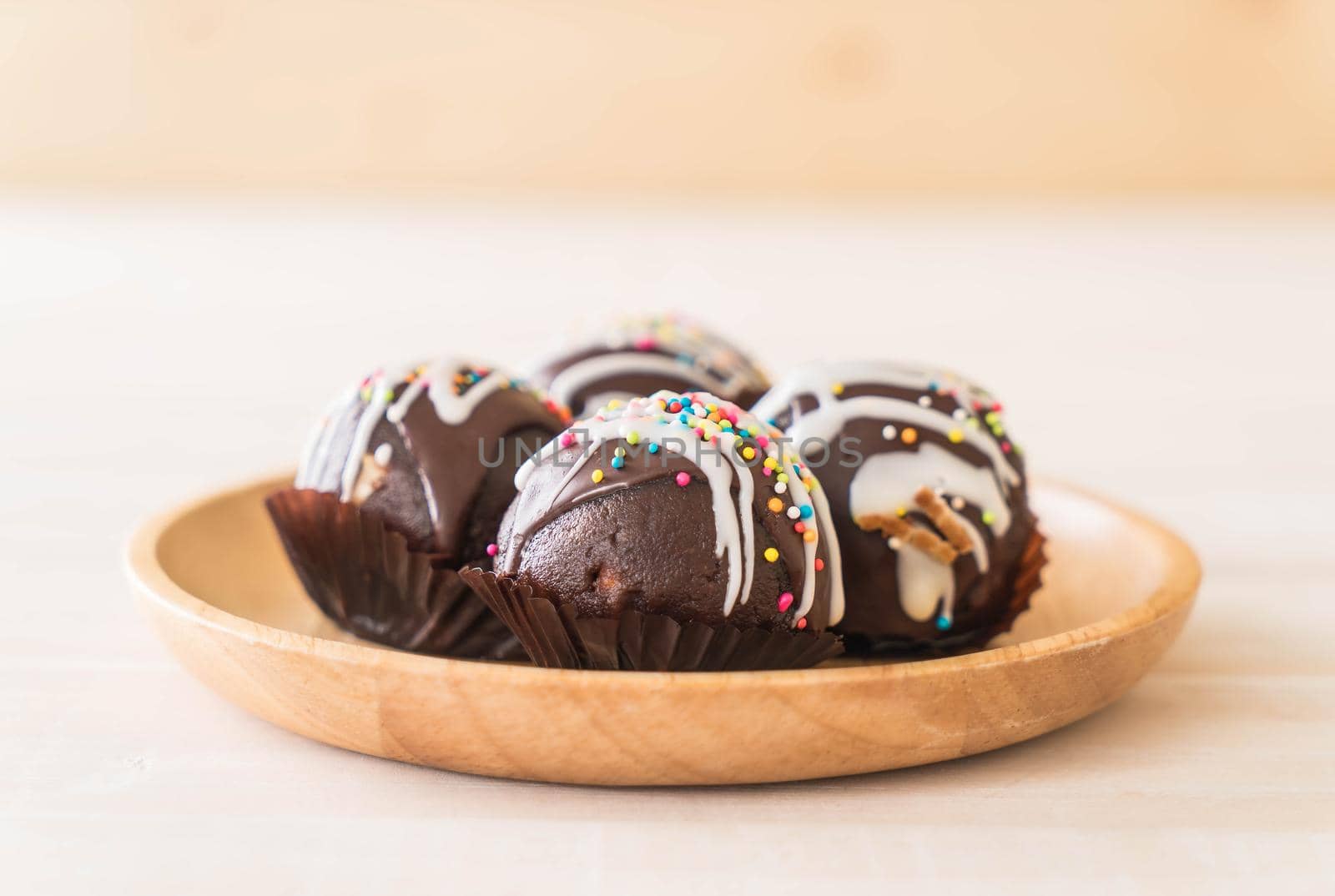 fancy chocolate ball on wood plate