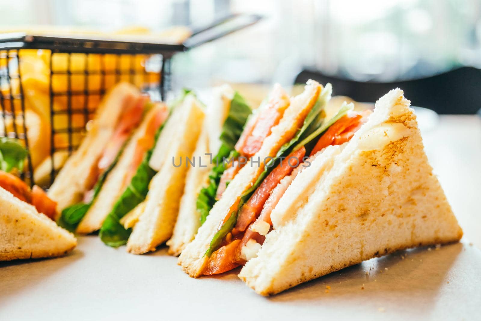 Chicken sandwich  and vegetable with french fries for breakfast