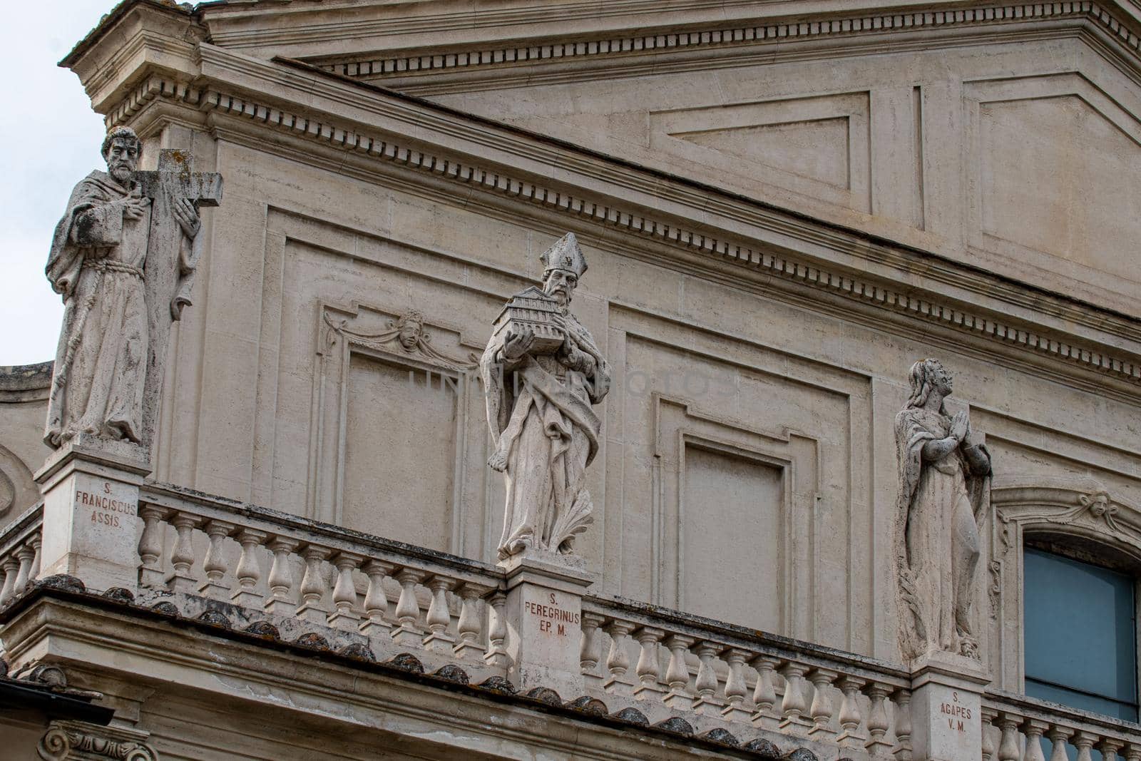 detail of the cathedral of terni sculptures placed on the facades of the saints