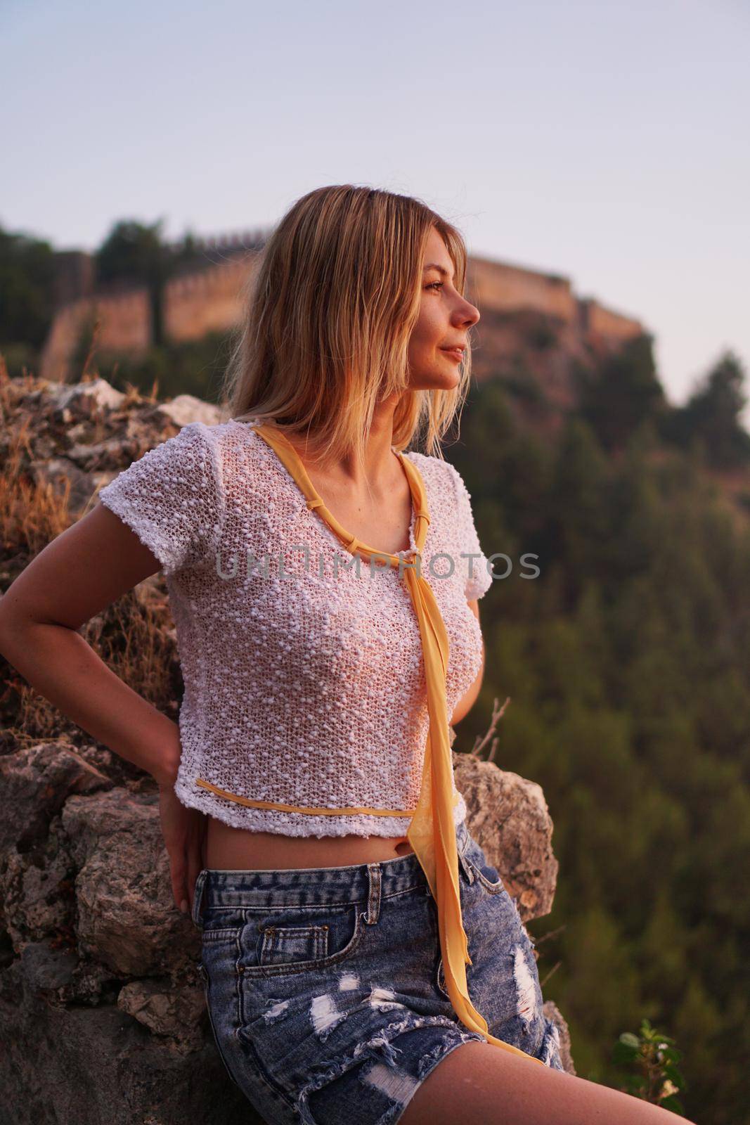 Beautiful girl at sunset. Ancient castle on the background. Alania Turkey by natali_brill