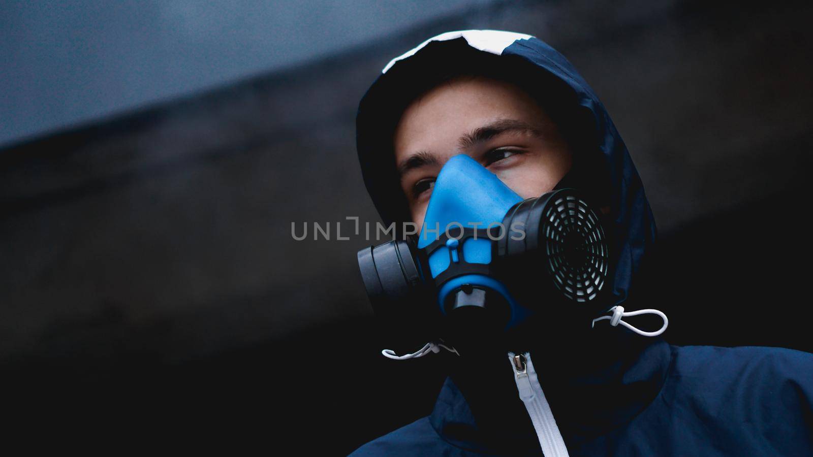 Protection respirator half mask for toxic gas.The man prepare to wear protection air pollution in the chemical industry